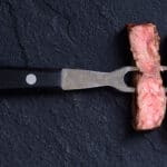 Grilled Beef Steak Ribeye On Meat Fork Sliced