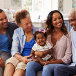 Grandparents and parents with a baby girl on mum??s knee